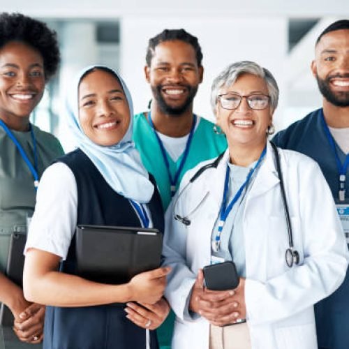 Portrait, diversity and happy team of doctors with teamwork excited, positive and proud in a hospital or clinic. Group, healthcare professional and medicine or medical experts in unity together